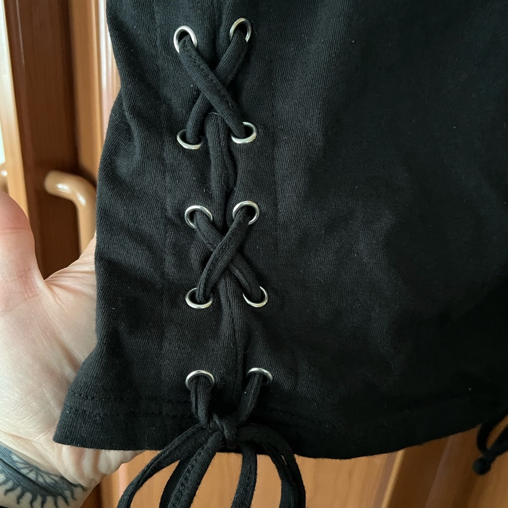Black crop top with laced ties on the sides